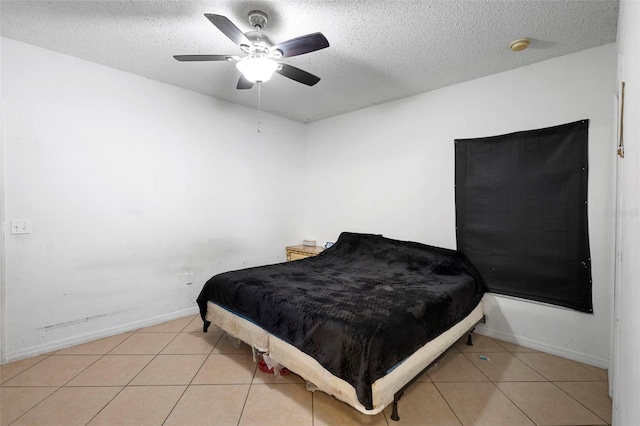 1040 Cannock Dr, Kissimmee, FL 34758 - tiled bedroom with a textured ceiling and ceiling fan