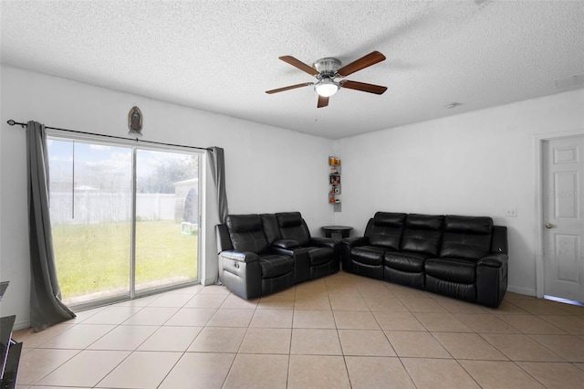 1040 Cannock Dr, Kissimmee, FL 34758 - living area featuring ceiling fan, a textured ceiling, and light tile patterned flooring