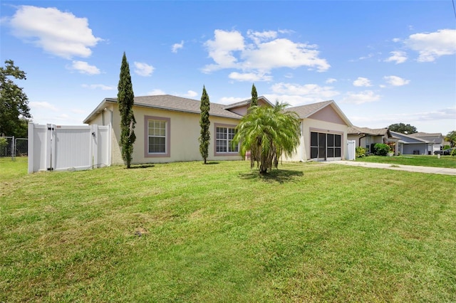 1040 Cannock Dr, Kissimmee, FL 34758 - view of front of property featuring concrete driveway, stucco siding, an attached garage, and a gate