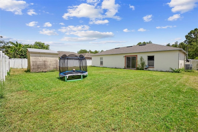1040 Cannock Dr, Kissimmee, FL 34758 - view of yard featuring a trampoline and a shed