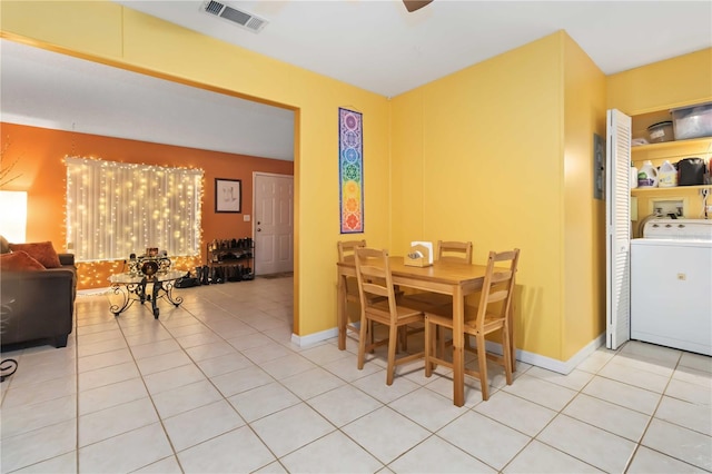 4235 Fay Blvd, Cocoa, FL 32927 - dining area featuring washer / dryer and light tile patterned flooring