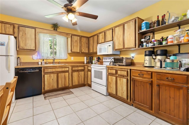 4235 Fay Blvd, Cocoa, FL 32927 - kitchen with white appliances, brown cabinets, a ceiling fan, and light countertops