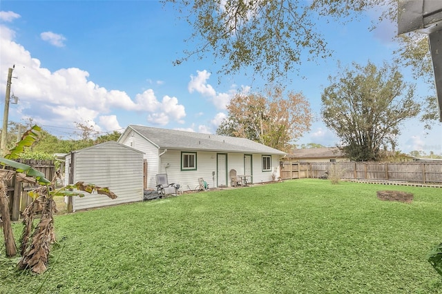 4235 Fay Blvd, Cocoa, FL 32927 - rear view of property featuring a fenced backyard and a storage unit