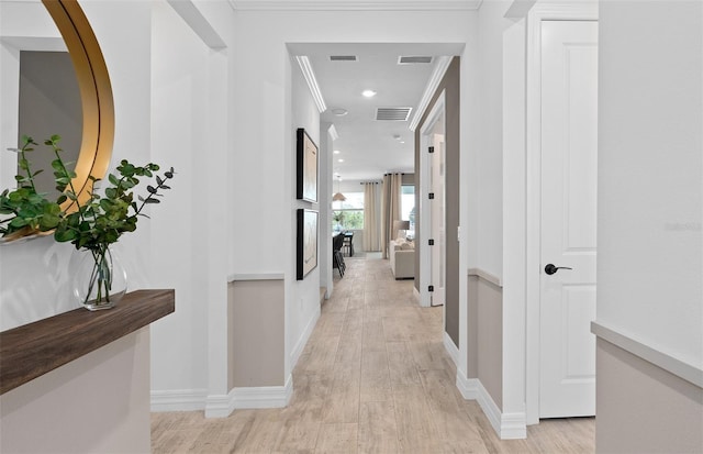 8267 Fenton St, Orlando, FL 32836 - hall with light wood finished floors, ornamental molding, and recessed lighting