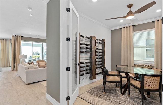 8267 Fenton St, Orlando, FL 32836 - dining room with crown molding, ceiling fan, recessed lighting, and light wood-type flooring