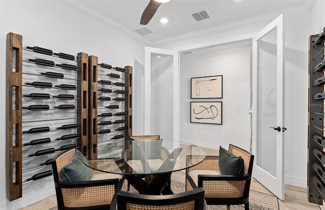 8267 Fenton St, Orlando, FL 32836 - wine area with light wood-style floors, a ceiling fan, ornamental molding, and recessed lighting