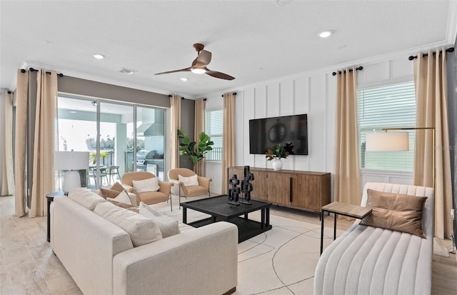 8267 Fenton St, Orlando, FL 32836 - living room with a ceiling fan, healthy amount of natural light, ornamental molding, light wood finished floors, and recessed lighting