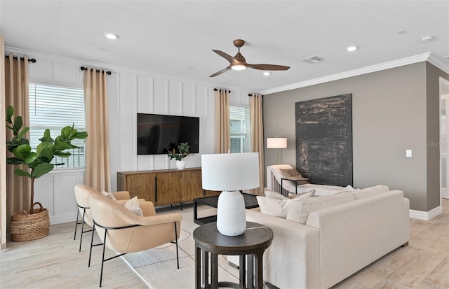 8267 Fenton St, Orlando, FL 32836 - living room featuring crown molding, a ceiling fan, light wood finished floors, plenty of natural light, and recessed lighting