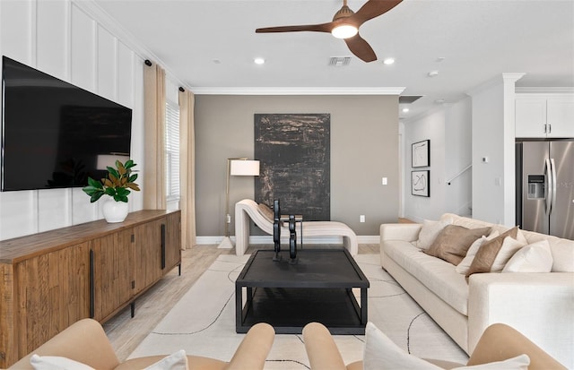 8267 Fenton St, Orlando, FL 32836 - living room featuring a ceiling fan, crown molding, light wood-style flooring, and recessed lighting