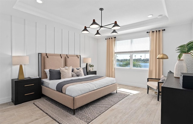 8267 Fenton St, Orlando, FL 32836 - bedroom with a raised ceiling, light wood finished floors, a chandelier, crown molding, and recessed lighting