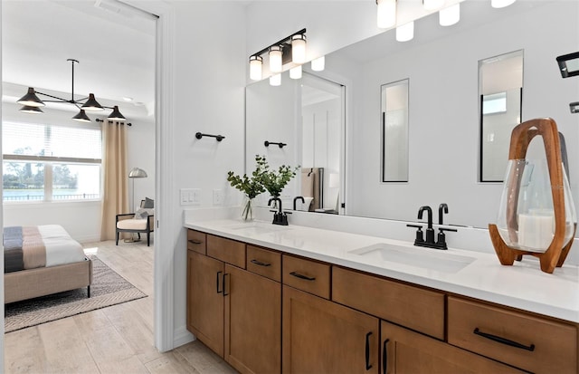8267 Fenton St, Orlando, FL 32836 - bathroom with ensuite bathroom, double vanity, and wood finished floors
