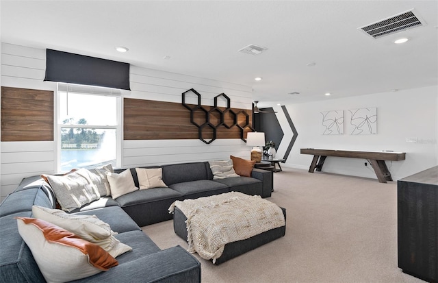 8267 Fenton St, Orlando, FL 32836 - carpeted living room with wood walls and recessed lighting