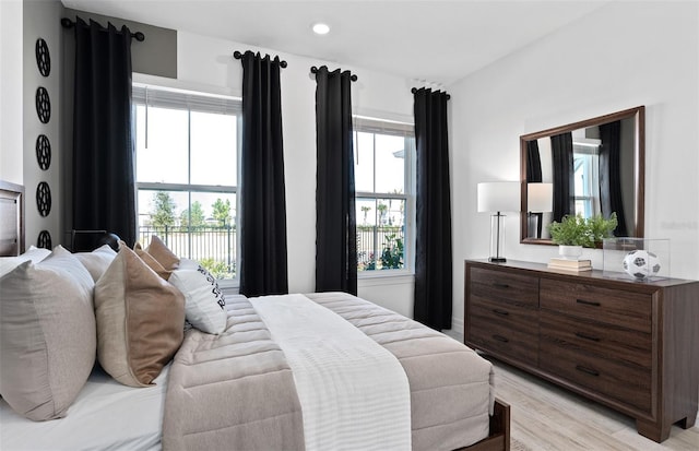 8267 Fenton St, Orlando, FL 32836 - bedroom featuring multiple windows, light wood finished floors, and recessed lighting