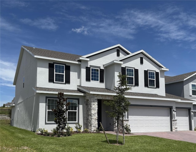 7260 Dilly Lake Ave, Groveland, FL 34736 - traditional-style house with stucco siding, an attached garage, a front yard, and driveway