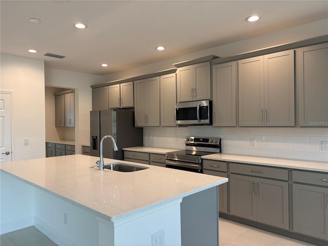 7260 Dilly Lake Ave, Groveland, FL 34736 - kitchen with appliances with stainless steel finishes, gray cabinets, recessed lighting, and tasteful backsplash