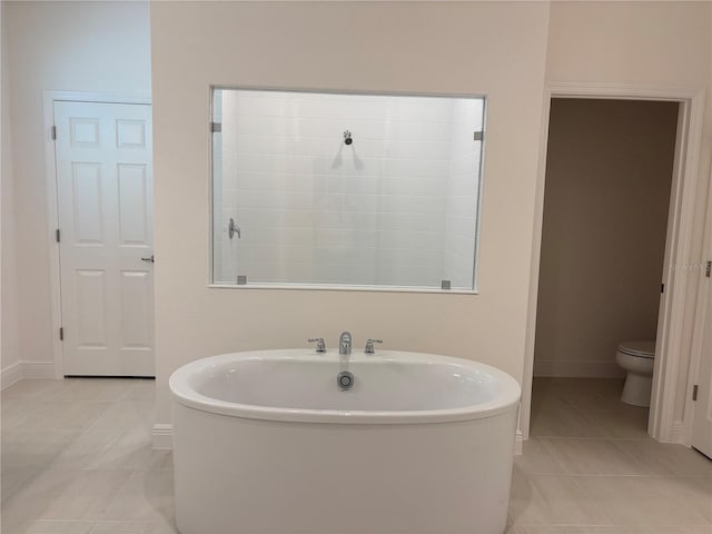 7260 Dilly Lake Ave, Groveland, FL 34736 - bathroom featuring tile patterned floors and a freestanding bath