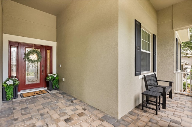 2018 Bay Clover Dr, Winter Garden, FL 34787 - entrance to property featuring stucco siding and covered porch