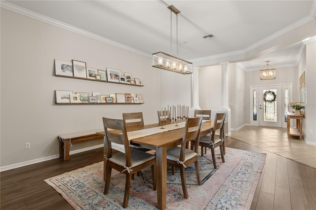 2018 Bay Clover Dr, Winter Garden, FL 34787 - dining space with wood finished floors, a chandelier, and crown molding