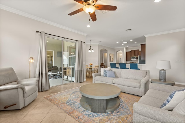 2018 Bay Clover Dr, Winter Garden, FL 34787 - living area featuring arched walkways, ceiling fan, light tile patterned floors, crown molding, and recessed lighting