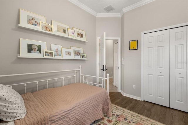 2018 Bay Clover Dr, Winter Garden, FL 34787 - bedroom featuring wood finished floors, crown molding, and a closet
