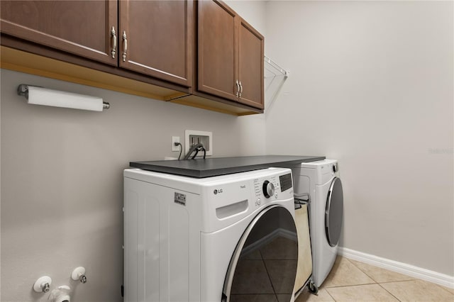 2018 Bay Clover Dr, Winter Garden, FL 34787 - laundry area with cabinet space, washing machine and dryer, and light tile patterned flooring
