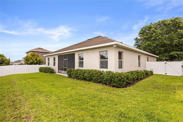 2018 Bay Clover Dr, Winter Garden, FL 34787 - back of property with a gate, stucco siding, and a fenced backyard
