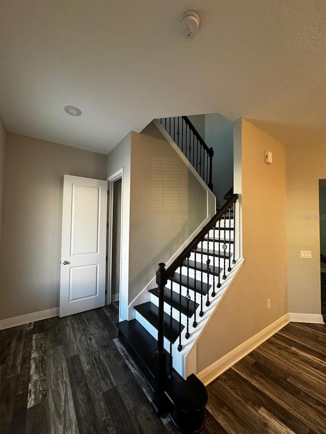 2435 Standing Rock Cir, Oakland, FL 34787 - stairway with wood finished floors