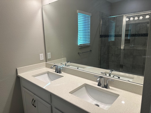 2435 Standing Rock Cir, Oakland, FL 34787 - bathroom featuring double vanity and a shower stall