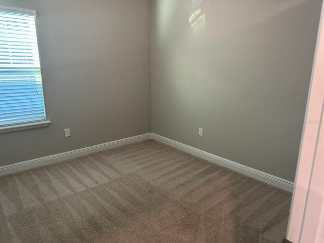 2435 Standing Rock Cir, Oakland, FL 34787 - carpeted spare room with baseboards