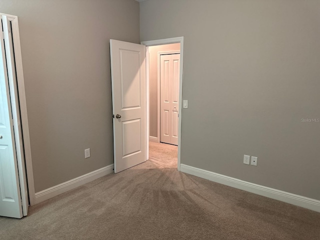 2435 Standing Rock Cir, Oakland, FL 34787 - unfurnished bedroom featuring carpet flooring and baseboards