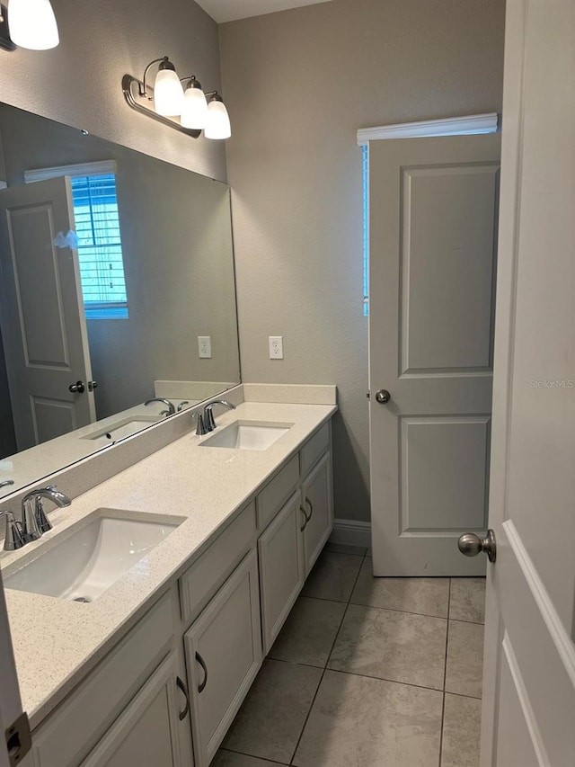 2435 Standing Rock Cir, Oakland, FL 34787 - full bath featuring double vanity and tile patterned flooring