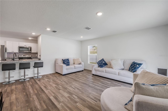 40 Briarvue Ln, Palm Coast, FL 32137 - living room featuring wood finished floors and recessed lighting