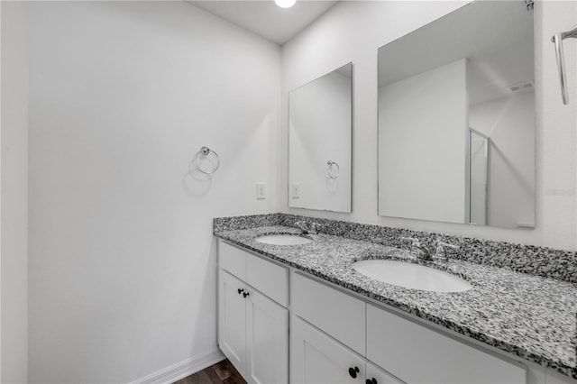 40 Briarvue Ln, Palm Coast, FL 32137 - bathroom with double vanity and wood finished floors