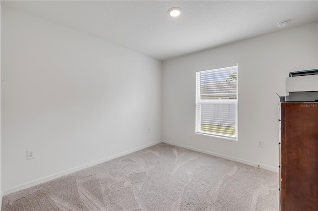 40 Briarvue Ln, Palm Coast, FL 32137 - carpeted spare room featuring a smoke detector and recessed lighting