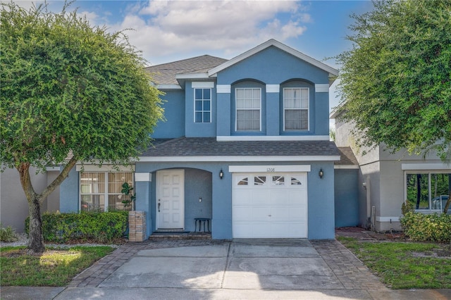 1208 Sandestin Way, Orlando, FL 32824 - traditional-style house with stucco siding, roof with shingles, and an attached garage
