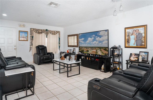 1208 Sandestin Way, Orlando, FL 32824 - living area with light tile patterned floors and a textured ceiling
