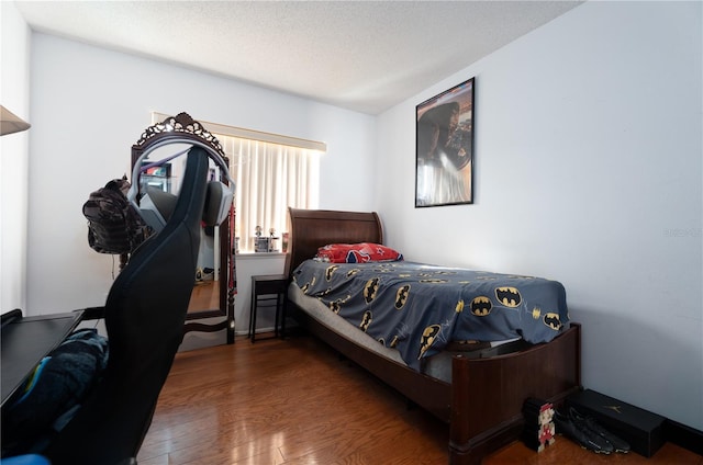 1208 Sandestin Way, Orlando, FL 32824 - bedroom featuring wood finished floors and a textured ceiling