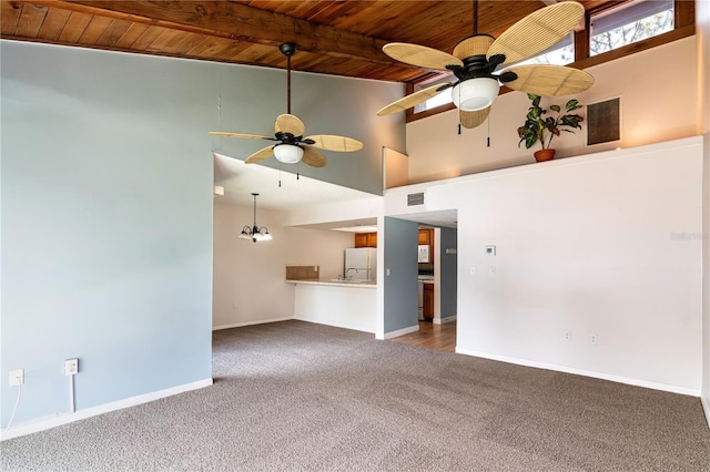 6019 Windhover Dr Unit C10-2, Orlando, FL 32819 - unfurnished living room featuring a wooden ceiling with exposed beams, a ceiling fan, carpet flooring, and high vaulted ceiling