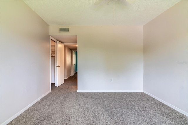 6019 Windhover Dr Unit C10-2, Orlando, FL 32819 - carpeted empty room with attic access and a textured ceiling