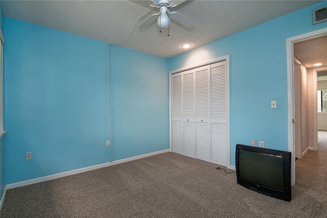 6019 Windhover Dr Unit C10-2, Orlando, FL 32819 - unfurnished bedroom featuring a closet, carpet, a textured ceiling, recessed lighting, and a ceiling fan