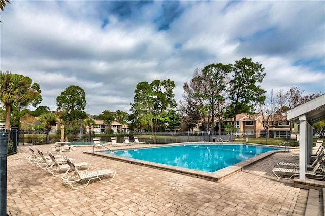 6019 Windhover Dr Unit C10-2, Orlando, FL 32819 - community pool featuring a patio area
