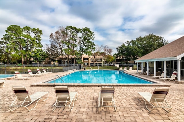 6019 Windhover Dr Unit C10-2, Orlando, FL 32819 - community pool with a patio area