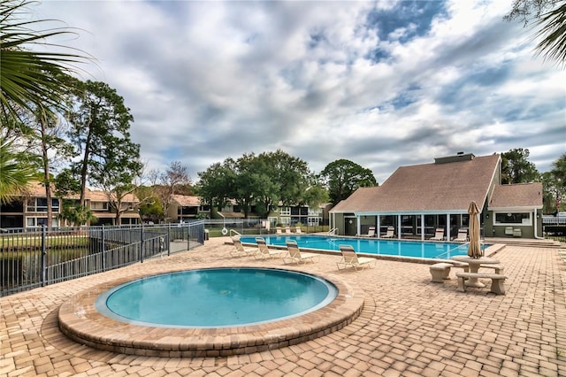 6019 Windhover Dr Unit C10-2, Orlando, FL 32819 - community pool featuring a patio