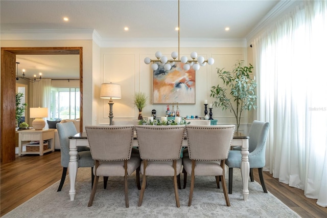 13235 Vennetta Way, Windermere, FL 34786 - dining area with a chandelier, wood finished floors, and ornamental molding