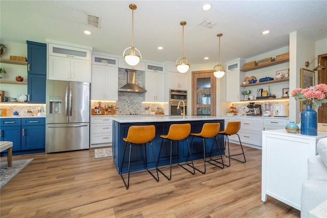 13235 Vennetta Way, Windermere, FL 34786 - kitchen with open shelves, appliances with stainless steel finishes, light countertops, a kitchen breakfast bar, and recessed lighting
