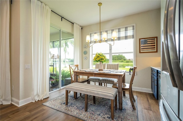 13235 Vennetta Way, Windermere, FL 34786 - dining space featuring a chandelier and wood finished floors