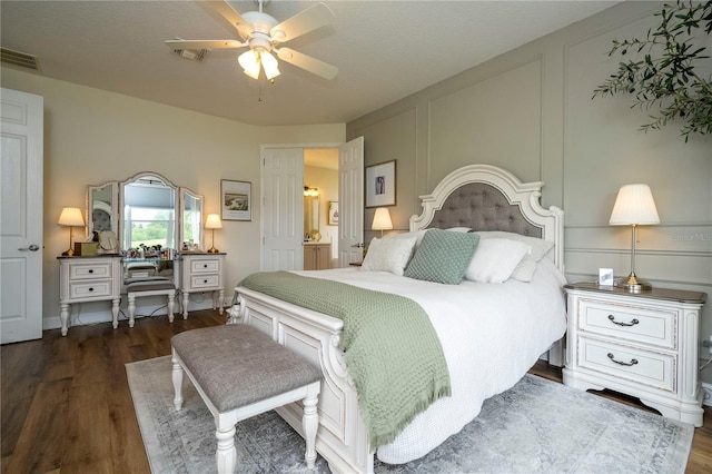 13235 Vennetta Way, Windermere, FL 34786 - bedroom featuring dark wood-style flooring, a decorative wall, and a ceiling fan