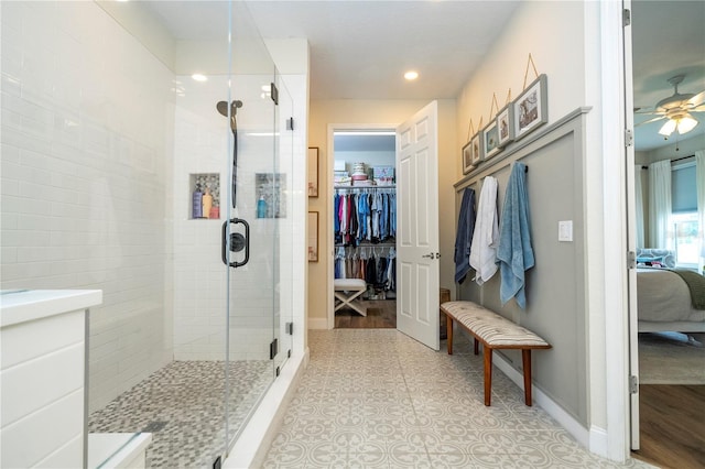 13235 Vennetta Way, Windermere, FL 34786 - bathroom featuring a stall shower, ceiling fan, ensuite bathroom, recessed lighting, and a walk in closet