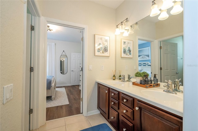 13235 Vennetta Way, Windermere, FL 34786 - bathroom featuring tile patterned floors, double vanity, and a chandelier