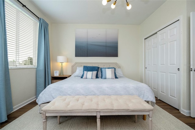 13235 Vennetta Way, Windermere, FL 34786 - bedroom with wood finished floors, a chandelier, and a closet